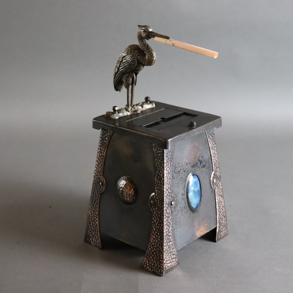 An Arts and Crafts Ruskin set mechanical ‘Stork’ cigarette dispenser View VIII