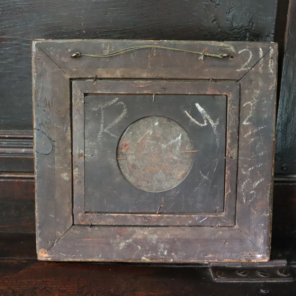 A small circular early 19th-century mythological oil painting depicting a reclining nude nymph and floating male god, encased in a square, highly ornate giltwood frame. View IV