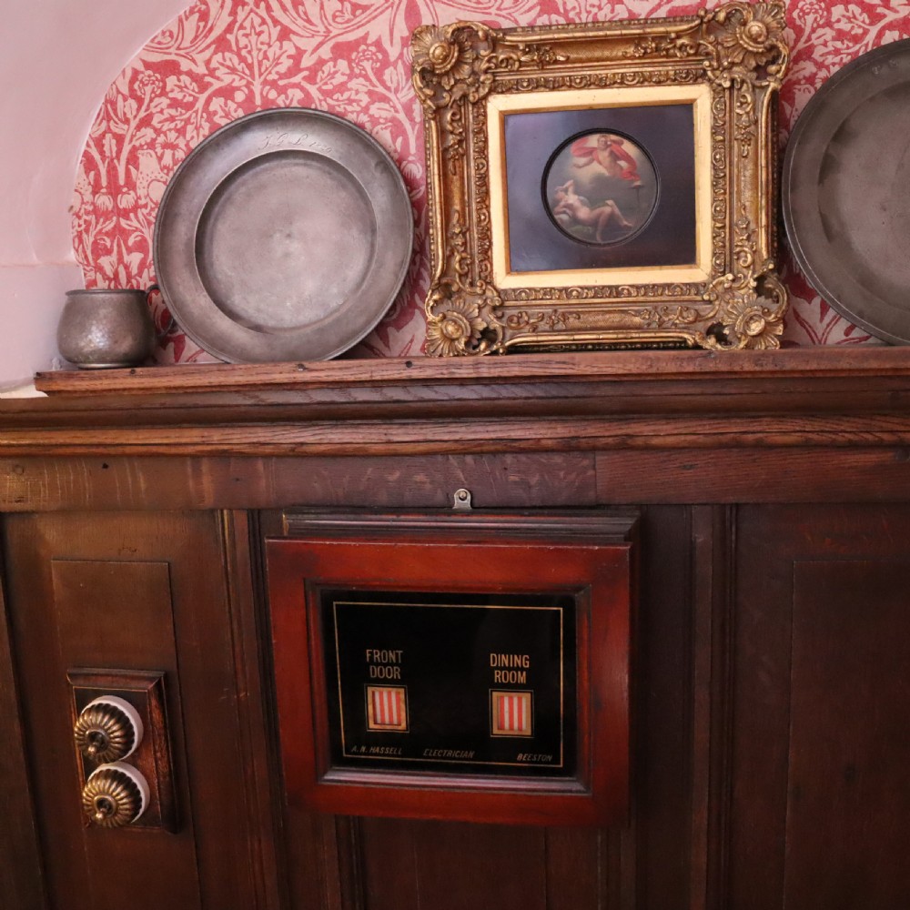 A small circular early 19th-century mythological oil painting depicting a reclining nude nymph and floating male god, encased in a square, highly ornate giltwood frame. View VII