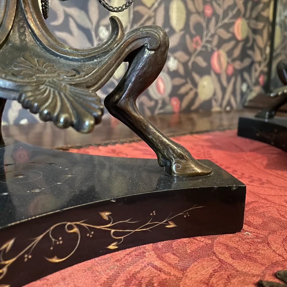 A pair of dark bronze Neoclassical candelabra featuring scrolling branches, bird finials, hanging chains, and black marble bases. View III