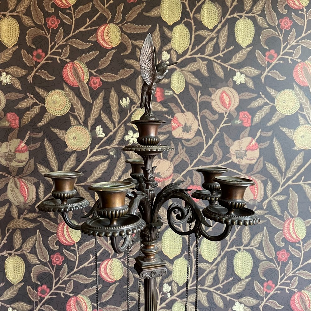 A pair of dark bronze Neoclassical candelabra featuring scrolling branches, bird finials, hanging chains, and black marble bases. View V