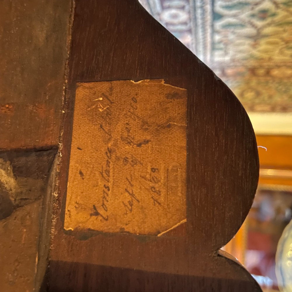 A Late Regency rectangular rosewood library table featuring inlaid floral marquetry along the frieze and pedestal supports. View III