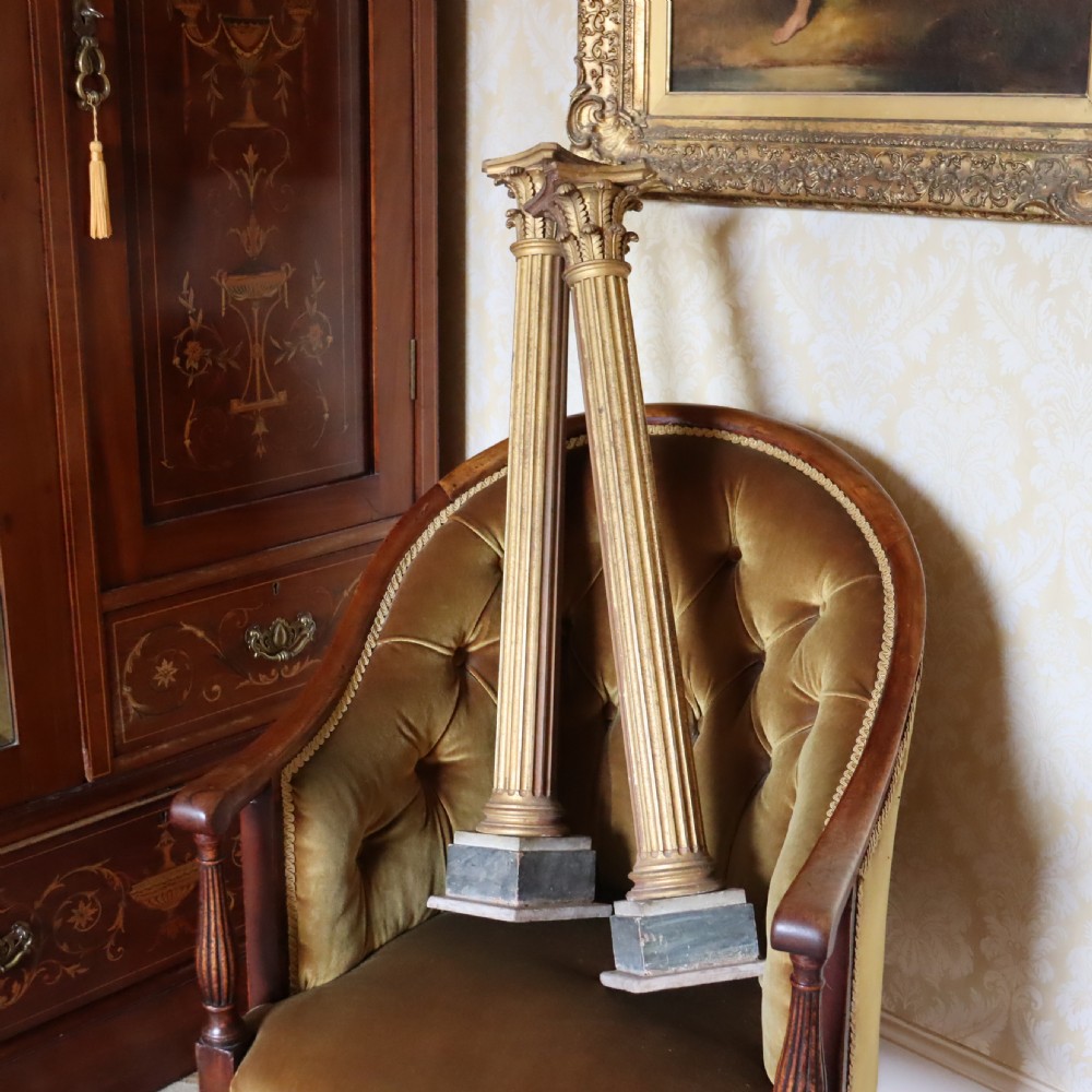 A pair of decorative 19th century carved and gilt wood fluted Corinthian columns View VII