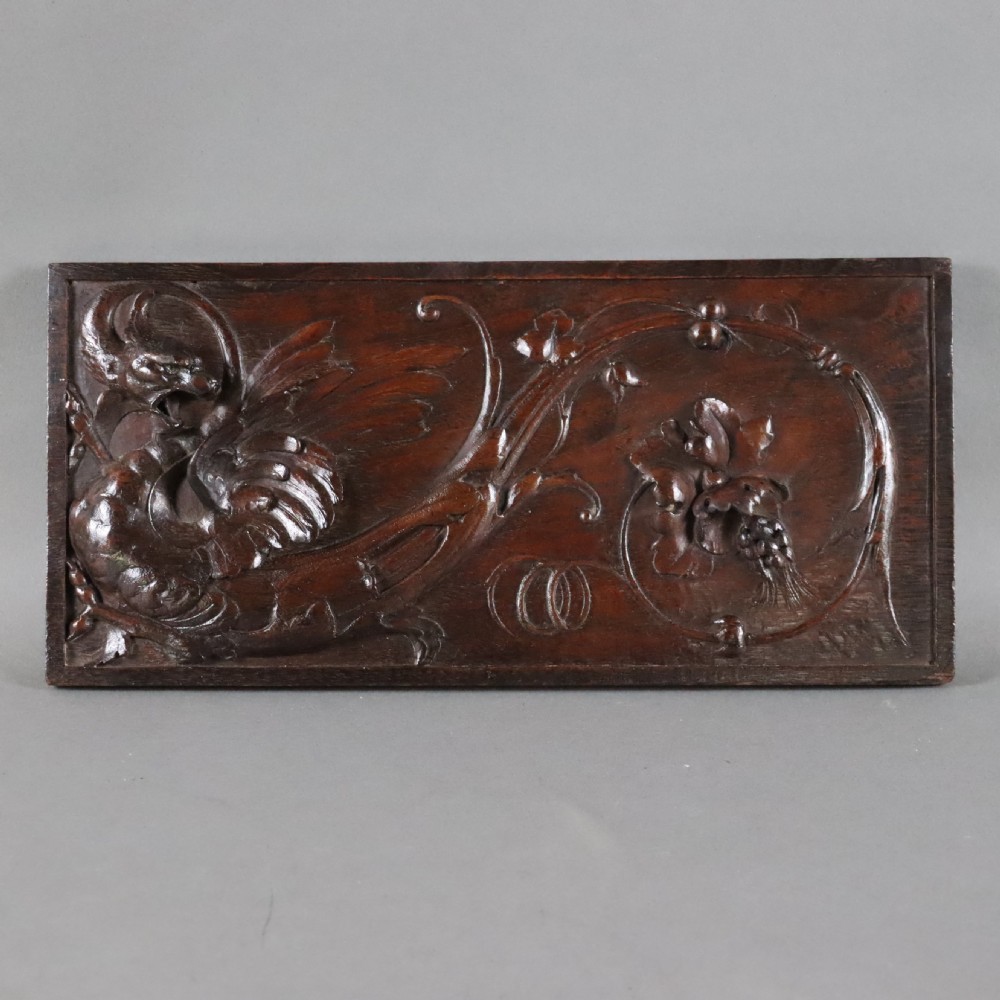 A 19th century carved walnut wall panel depicting a Wyvern or dragon View IV