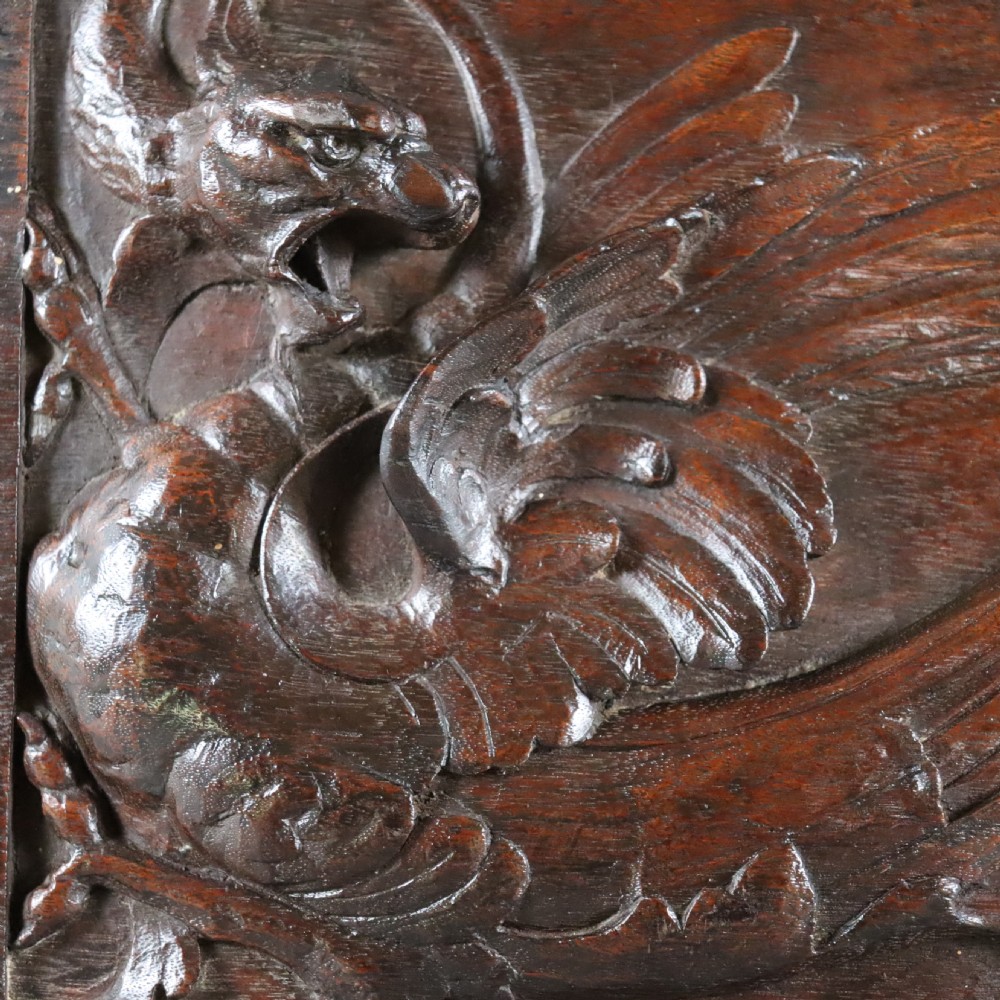 A 19th century carved walnut wall panel depicting a Wyvern or dragon View V