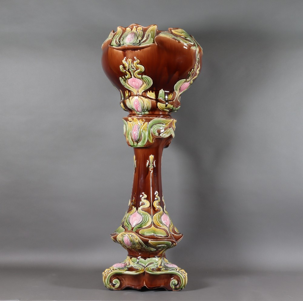 An Art Nouveau majolica jardiniere and stand. Circa1900 