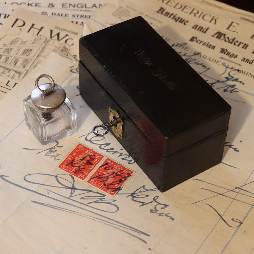 Leather covered stamp box and damper.  Circa 1900