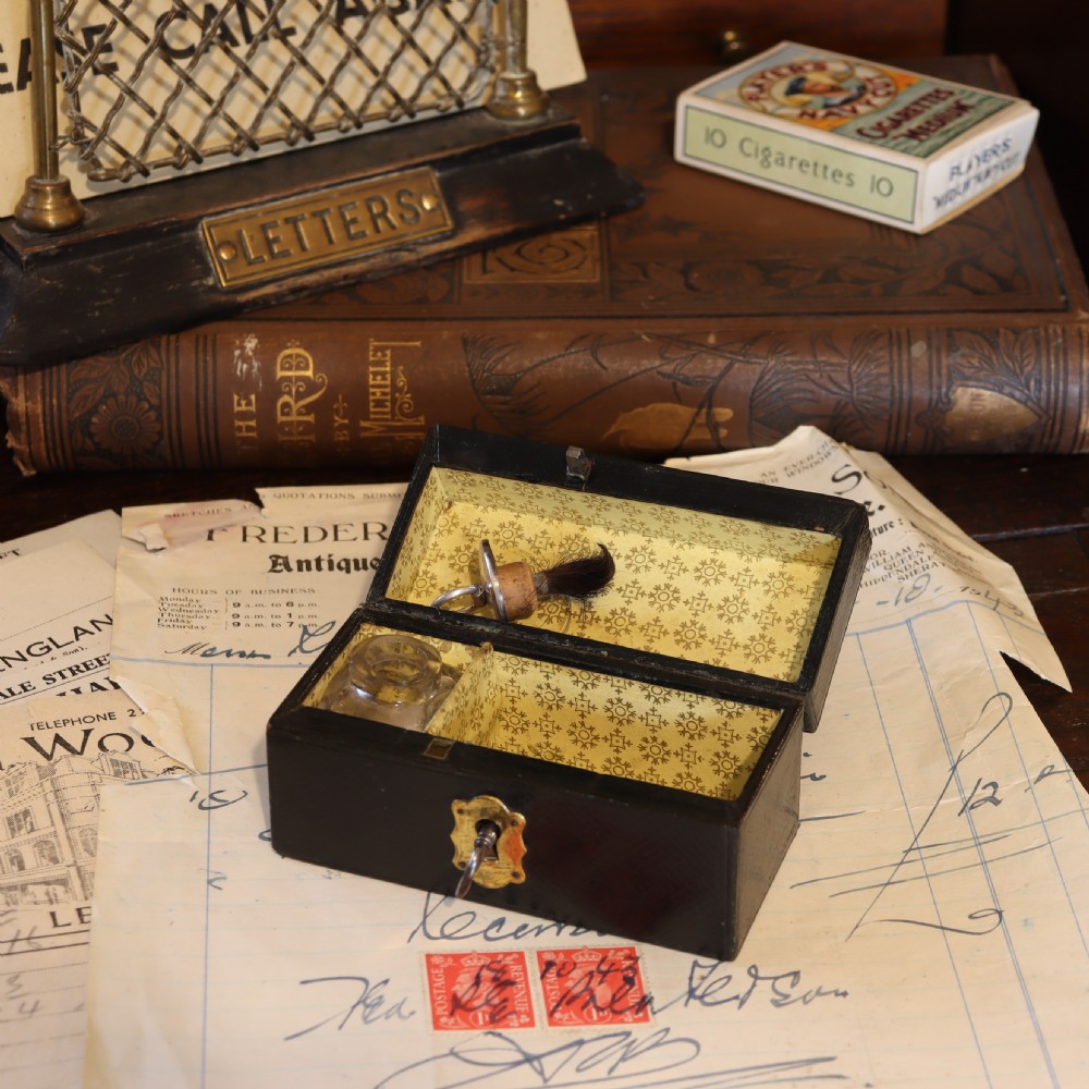Leather covered stamp box and damper.  Circa 1900 View V