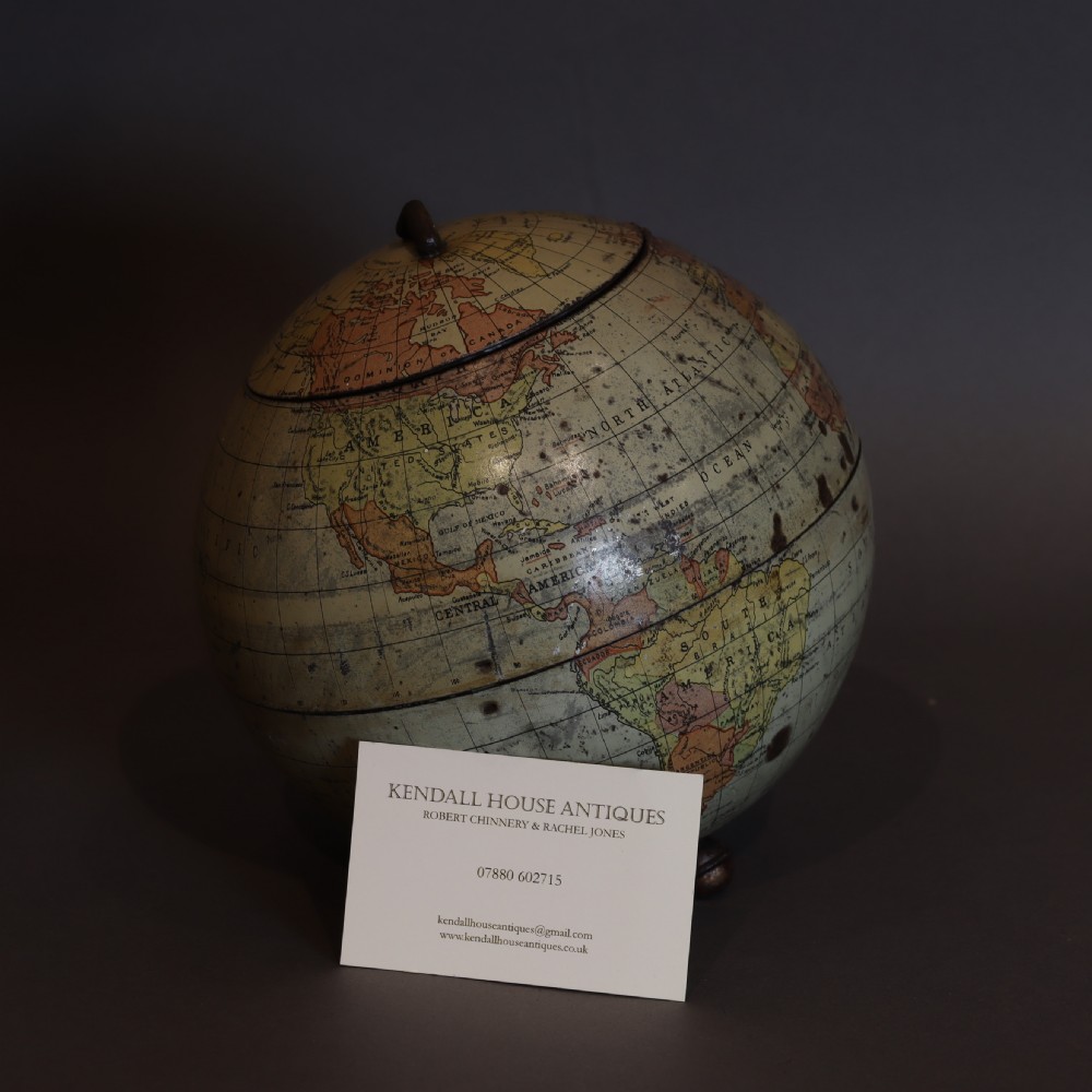 A Huntley and Palmers biscuit tin, in the form of a globe  View XI
