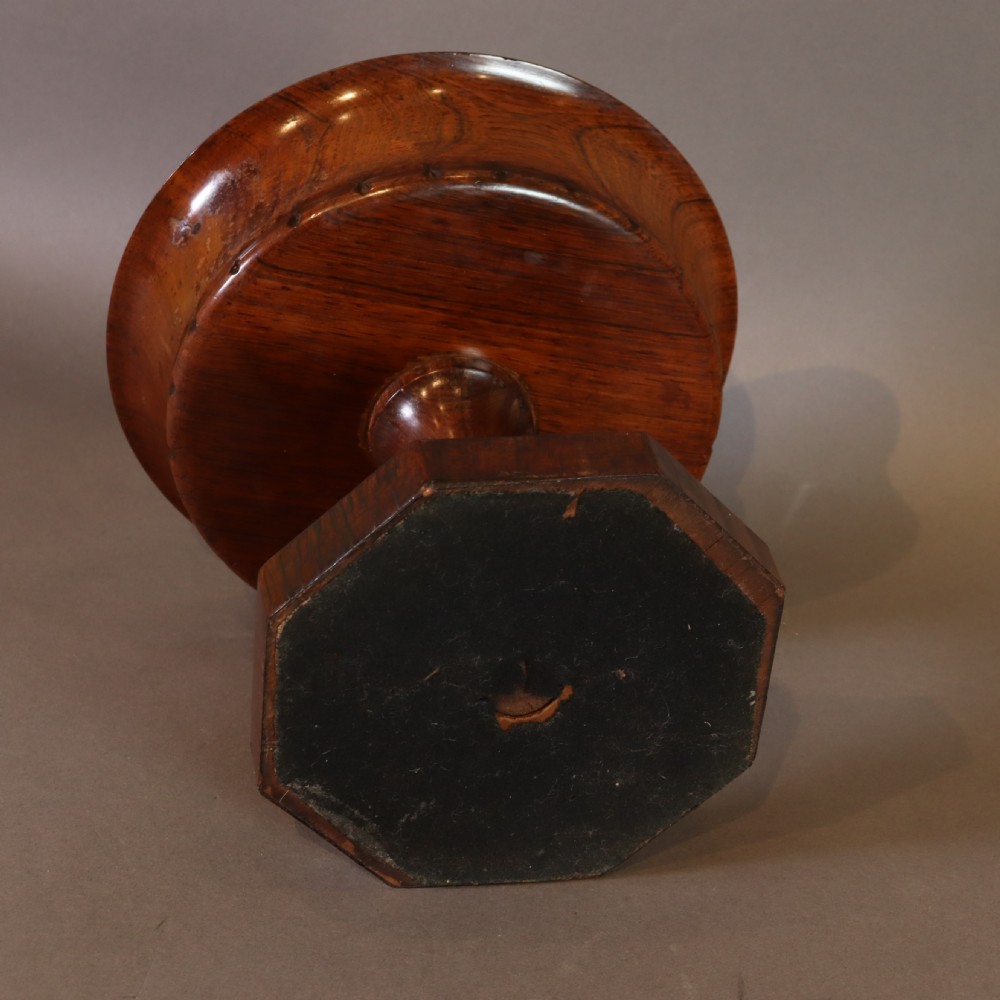 A dark rosewood tazza urn featuring a circular flared rim with an integrated brass liner, supported by a turned pedestal on an octagonal wooden base. View IX