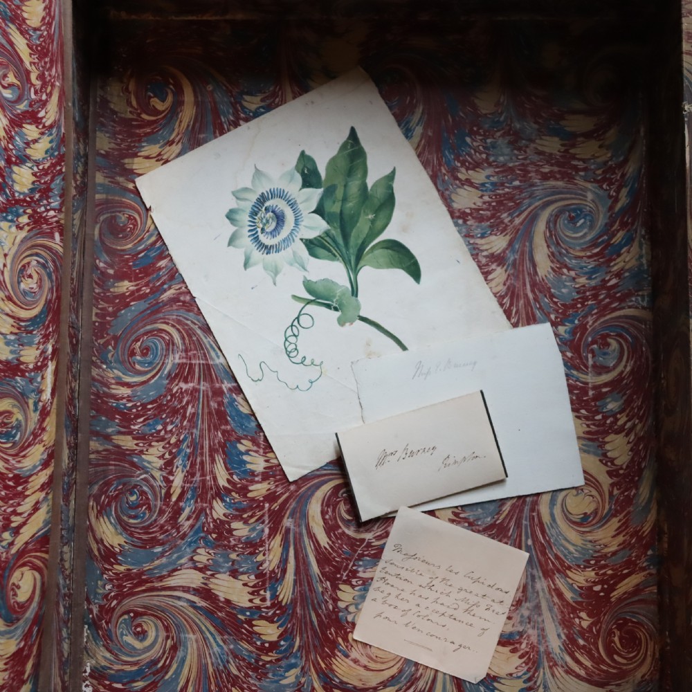 An upright dark brown leather-bound box designed to resemble a large book, embossed with the text Lambeth Palace on the spine and front cover. View IX