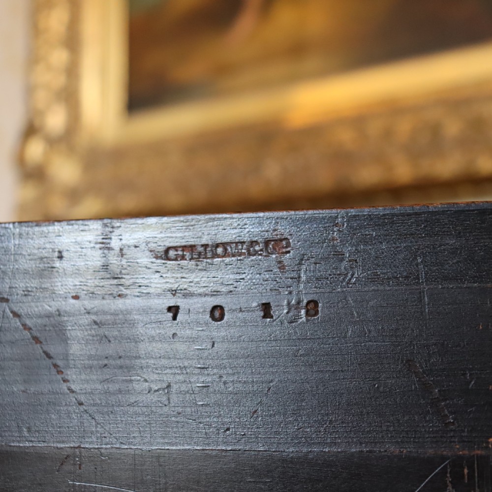 An ebonised Victorian Aesthetic Movement display pedestal featuring inset burr walnut panels, gilt incised frieze detailing, and a moulded square top. View IV