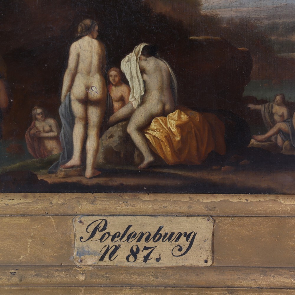 A 17th-century oil painting depicting classical bathing figures in an Arcadian landscape, framed in a heavy giltwood frame with a nameplate. View IV