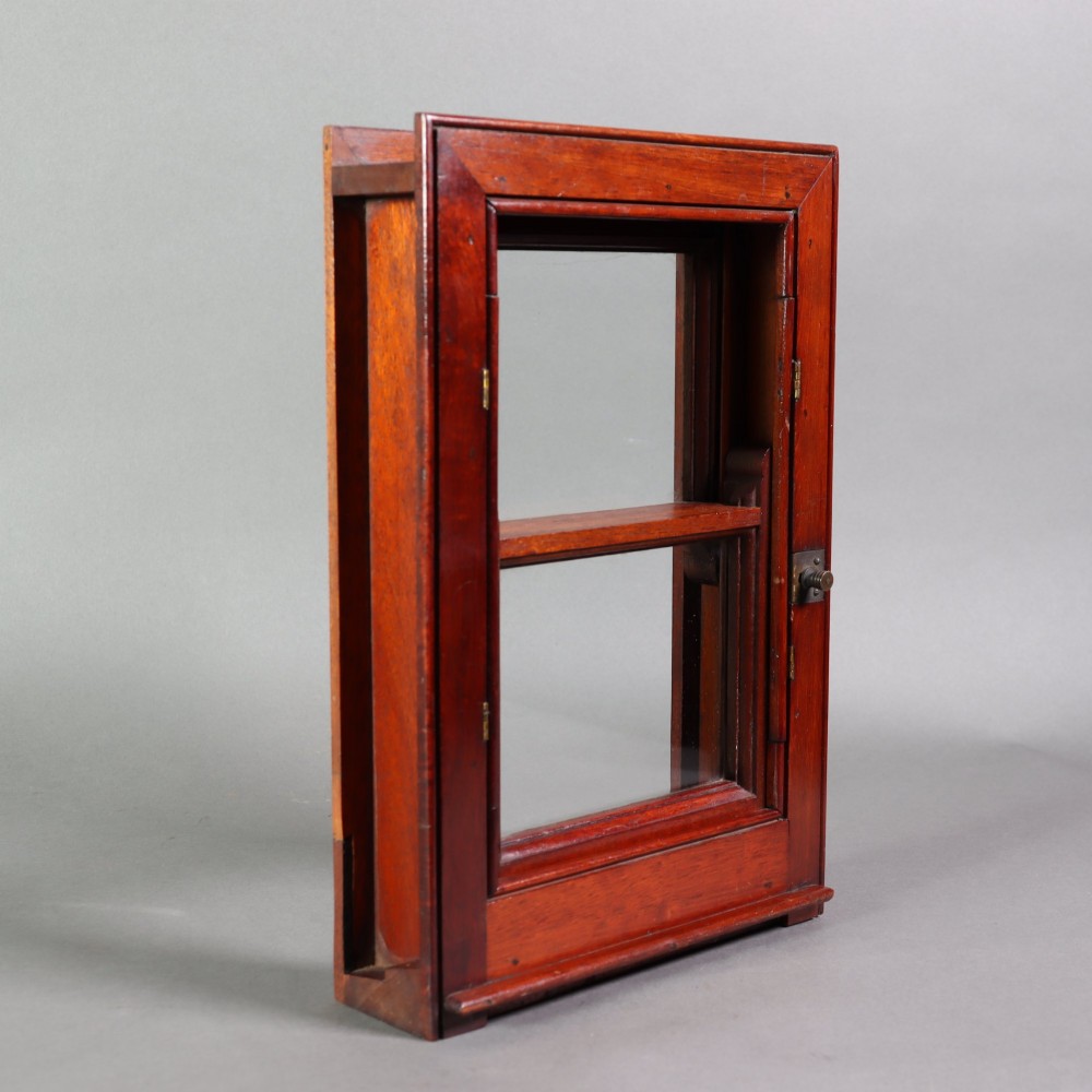 A 19th-century miniature mahogany sash window model featuring glazed panes and a polished timber frame. View IV