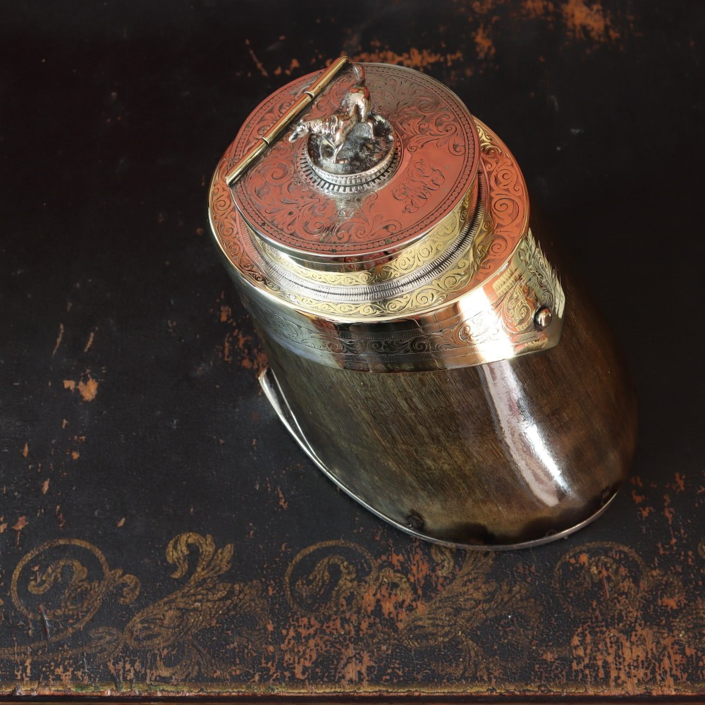 A Victorian desk tidy crafted from a preserved horse hoof with engraved silver mounts and a lid featuring a sculpted horse figurine. View III