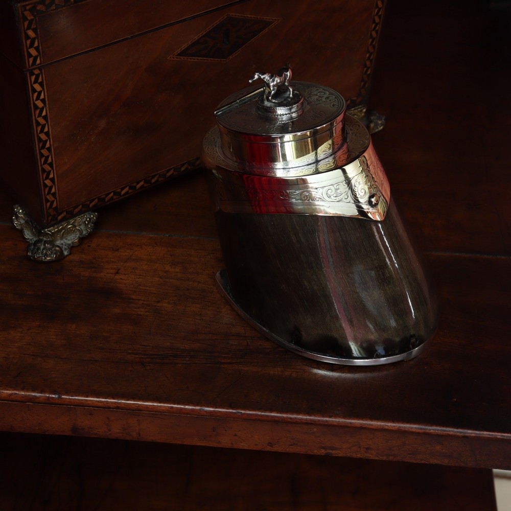 A Victorian desk tidy crafted from a preserved horse hoof with engraved silver mounts and a lid featuring a sculpted horse figurine. View IV
