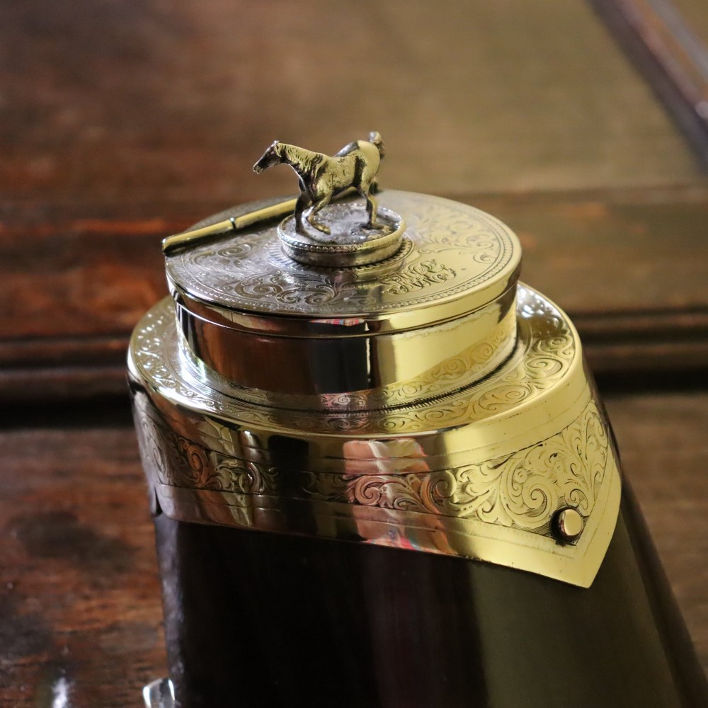 A Victorian desk tidy crafted from a preserved horse hoof with engraved silver mounts and a lid featuring a sculpted horse figurine. View V