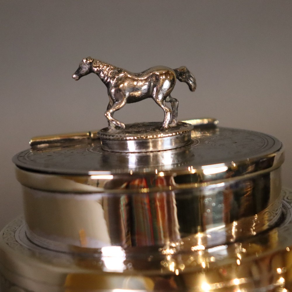 A Victorian desk tidy crafted from a preserved horse hoof with engraved silver mounts and a lid featuring a sculpted horse figurine. View VII