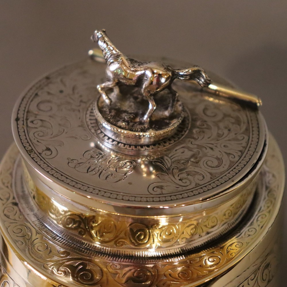 A Victorian desk tidy crafted from a preserved horse hoof with engraved silver mounts and a lid featuring a sculpted horse figurine. View VIII