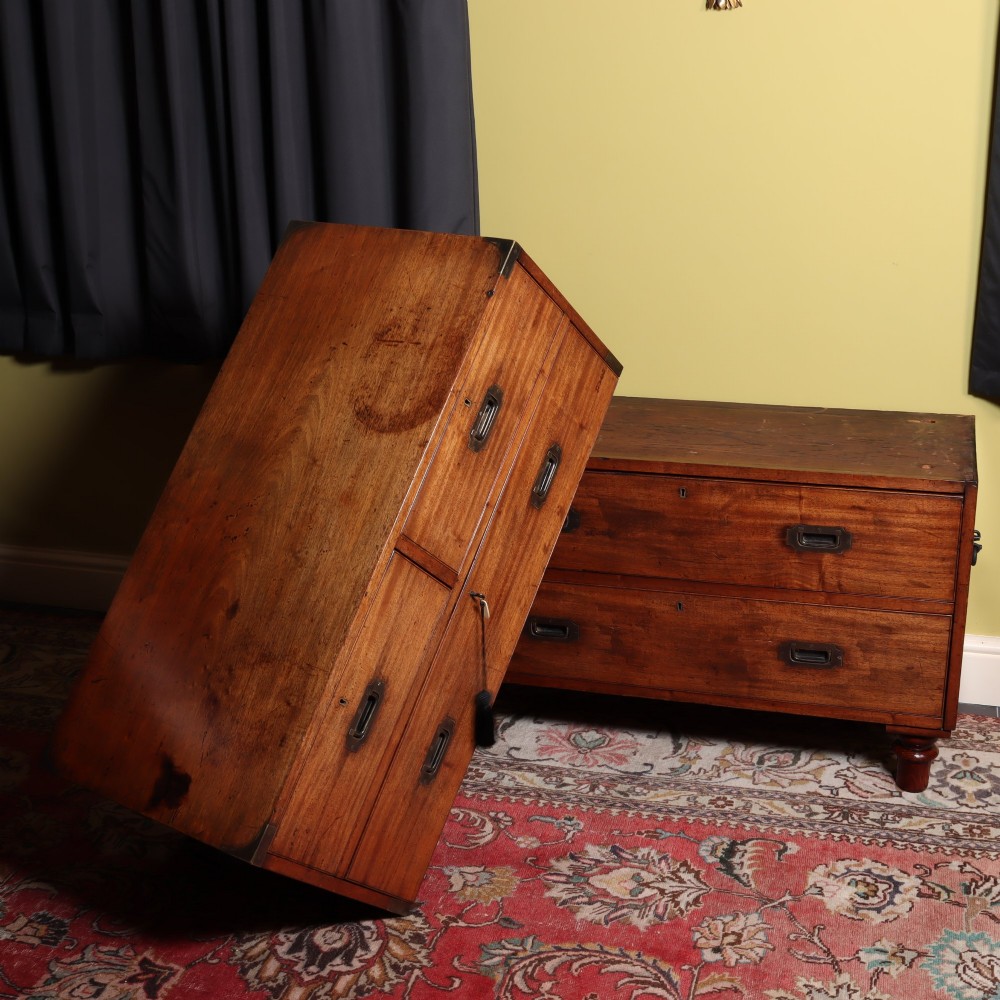 A Victorian mahogany two-part military campaign chest of drawers featuring recessed brass handles, corner brackets, side carrying handles, and short turned feet. View III