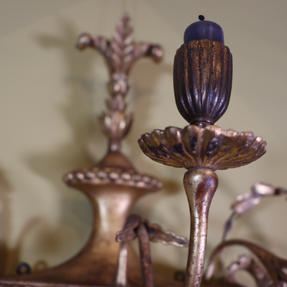 A George III style carved giltwood three-branch wall sconce featuring a central fluted urn motif flanked by scrolling foliate arms. View VI