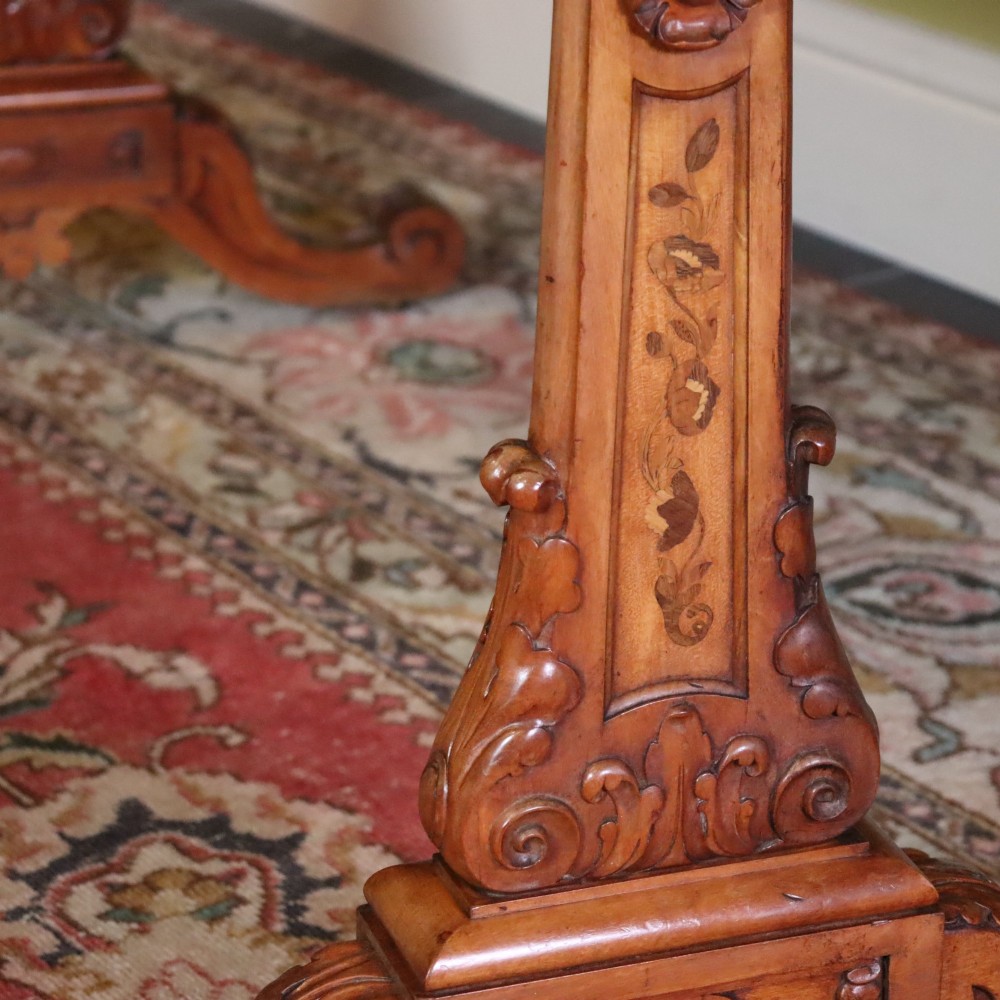 A Victorian satinwood side table featuring two frieze drawers with small round knobs, supported by carved trestle ends connected by a turned stretcher. View IV