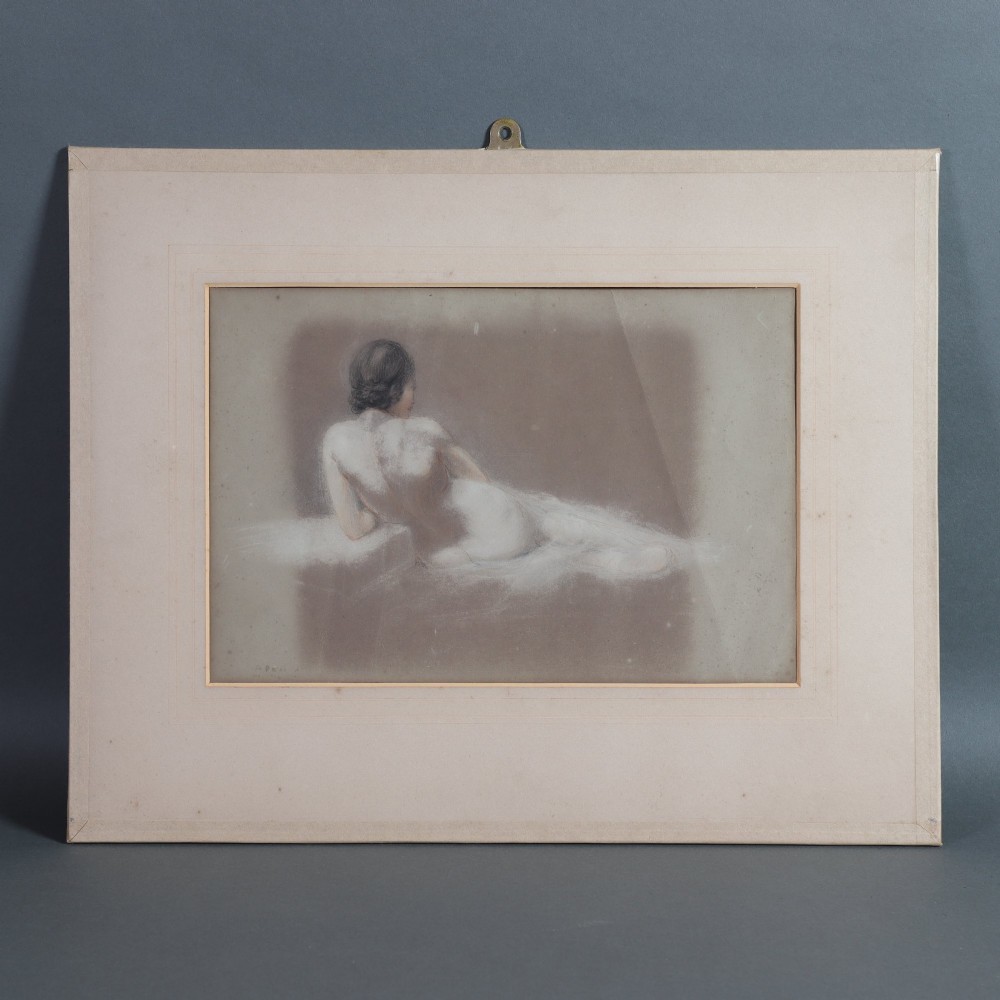 A framed mixed media figure study on grey paper depicting the back profile of a recumbent female nude resting against a light background.