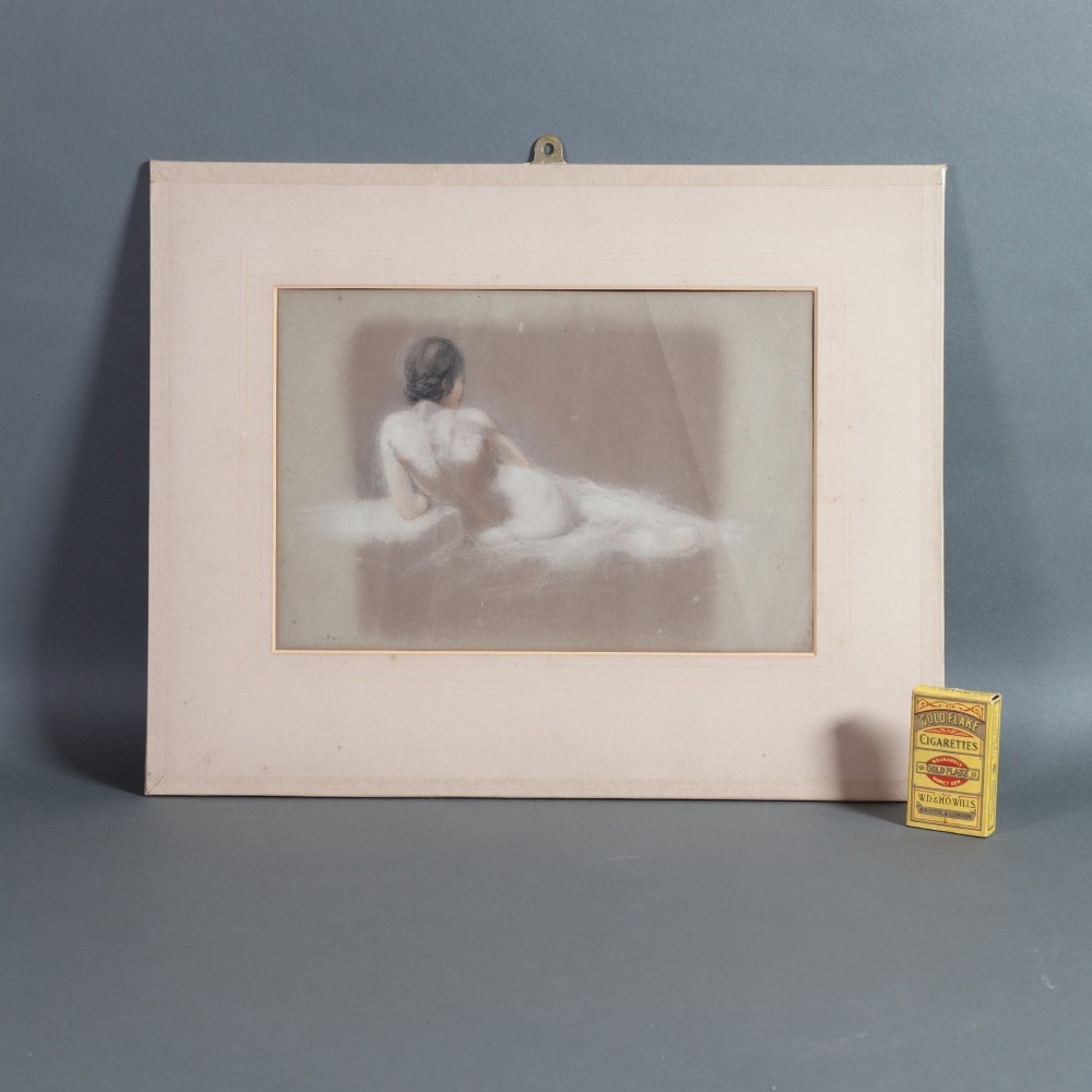 A framed mixed media figure study on grey paper depicting the back profile of a recumbent female nude resting against a light background. View V