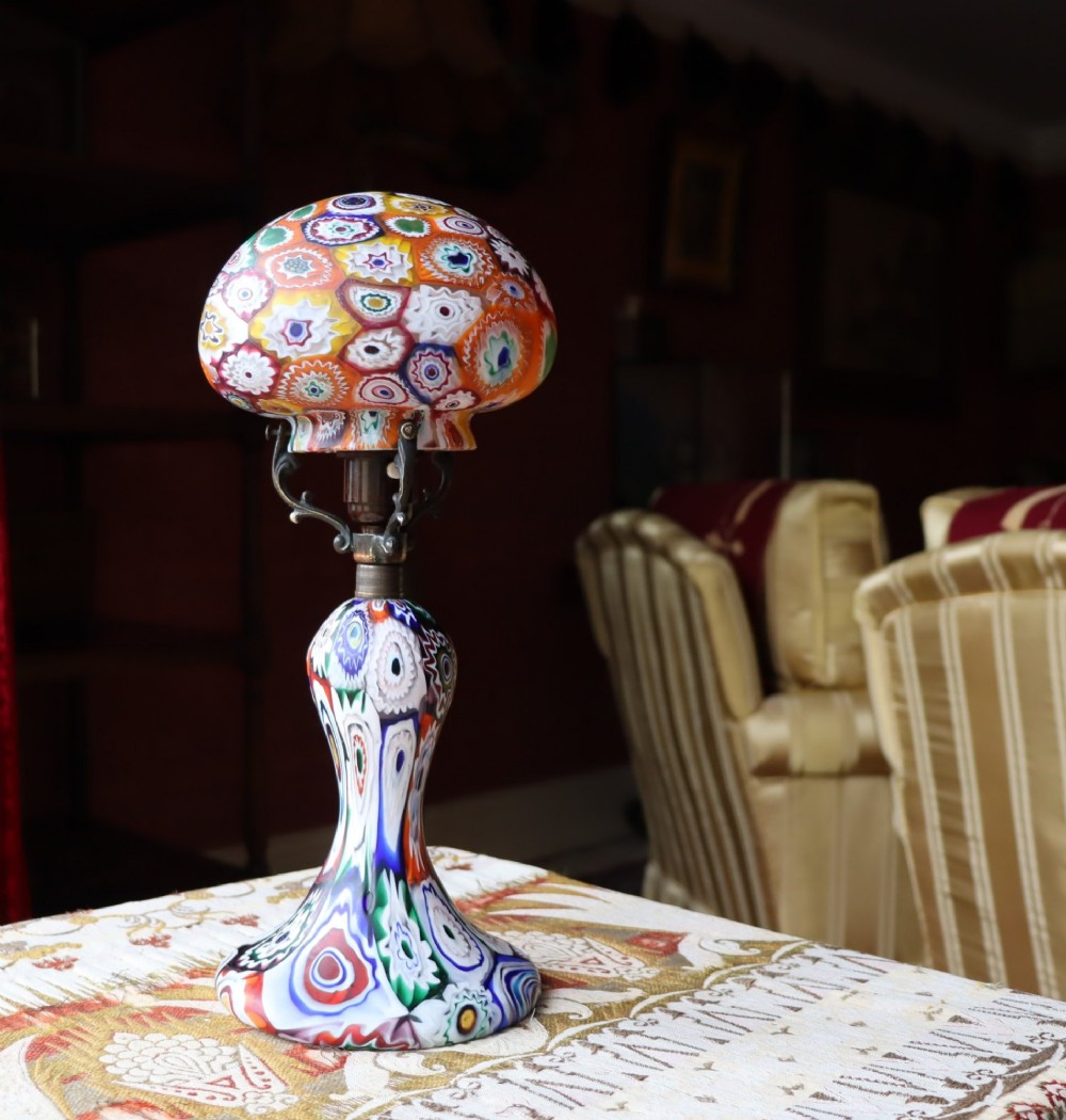 An Italian Art Deco millefiori glass table lamp featuring a colourful patterned mushroom shade and matching flared stem base with brass fittings. View VIII