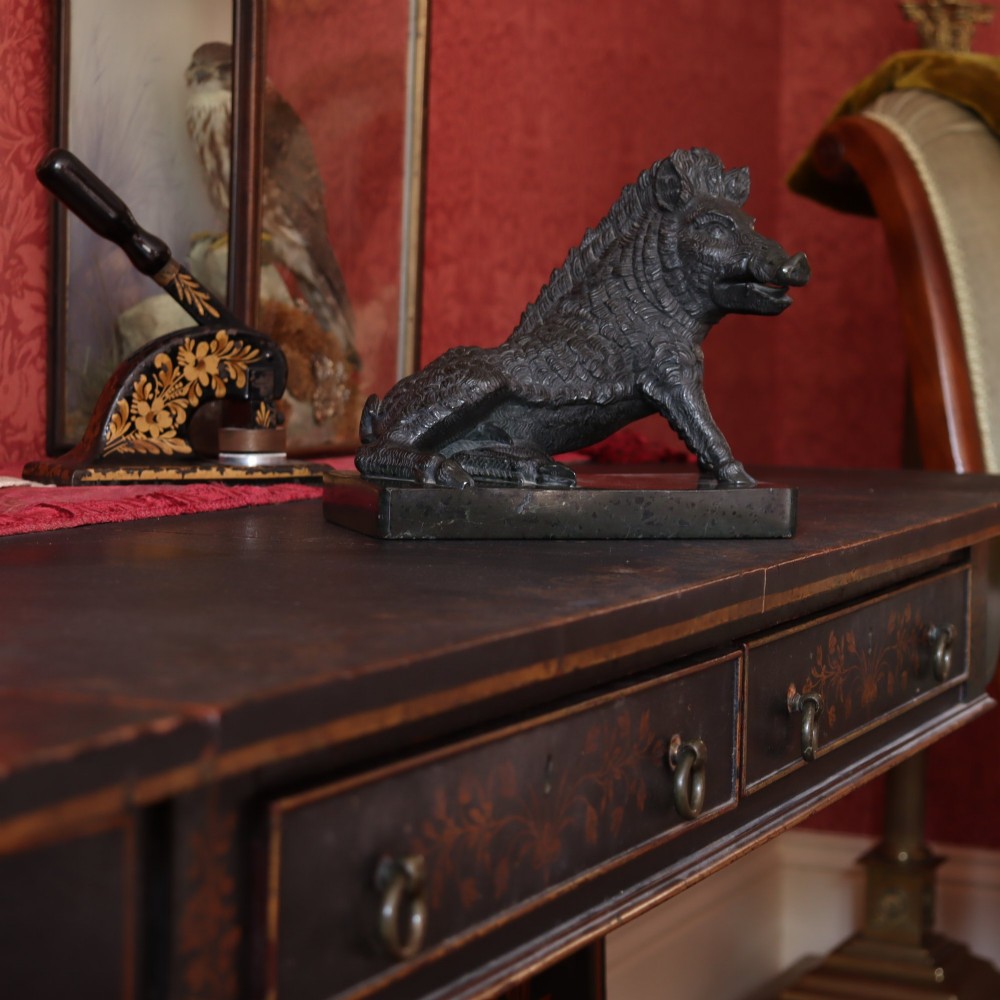 A late nineteenth-century Italian Grand Tour sculpture of a seated wild boar carved from dark green serpentine marble set on a rectangular stone plinth. View IV