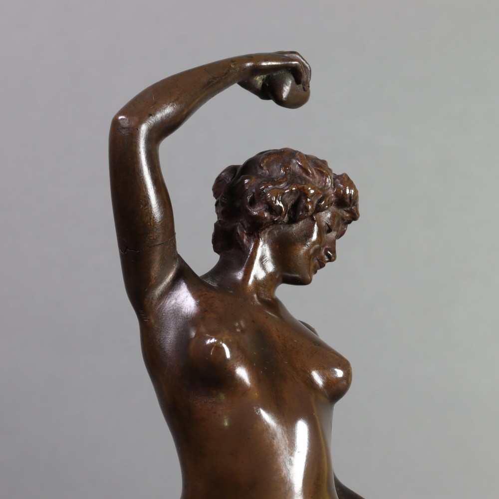 An Art Nouveau patinated bronze sculpture of a standing female figure with two cats mounted on a red marble base. View VI