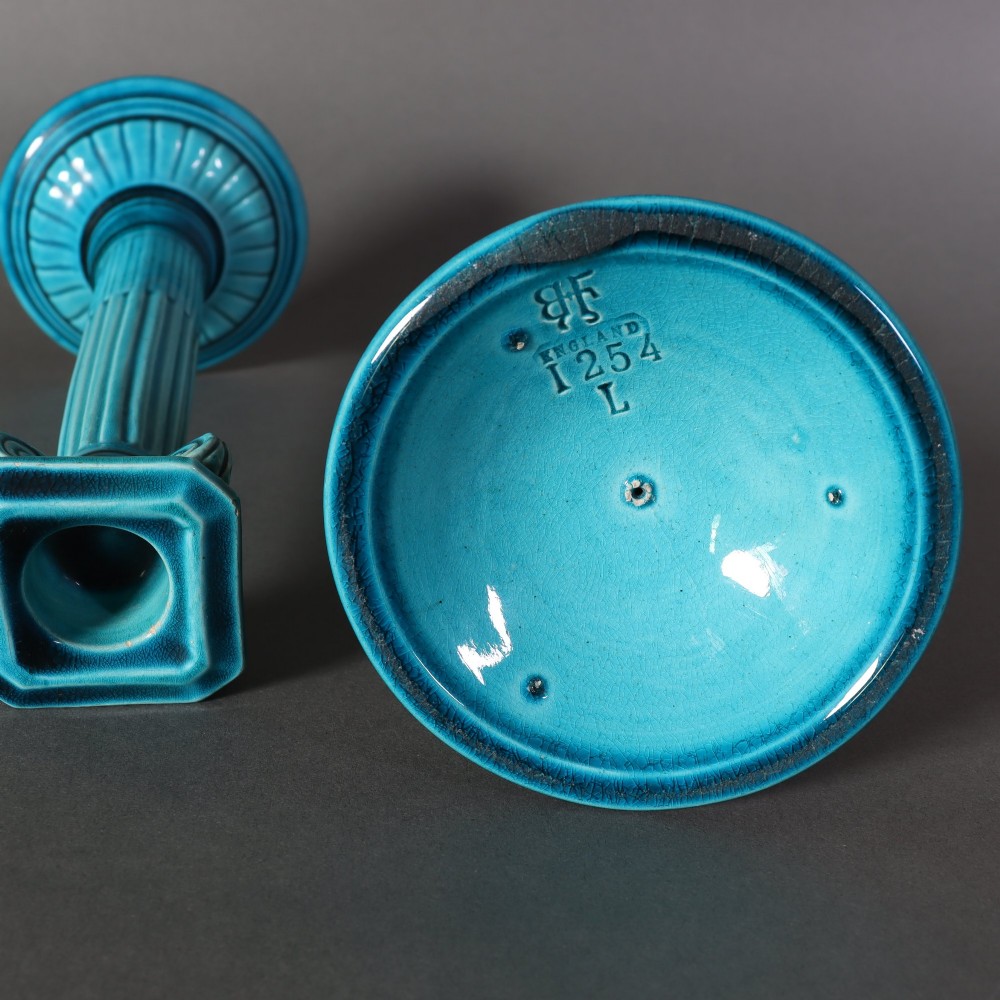A matched pair of late 19th-century turquoise glazed ceramic candlesticks in the shape of classical fluted Ionic columns. View III