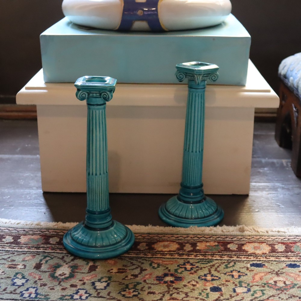 A matched pair of late 19th-century turquoise glazed ceramic candlesticks in the shape of classical fluted Ionic columns. View VII