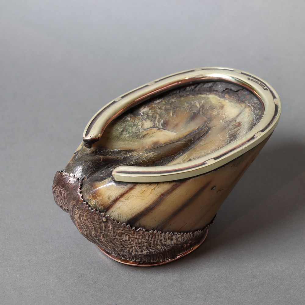 A preserved horse hoof mounted with an engraved brass top plate detailing military service dates and fitted with a polished brass rim around the base. View IV