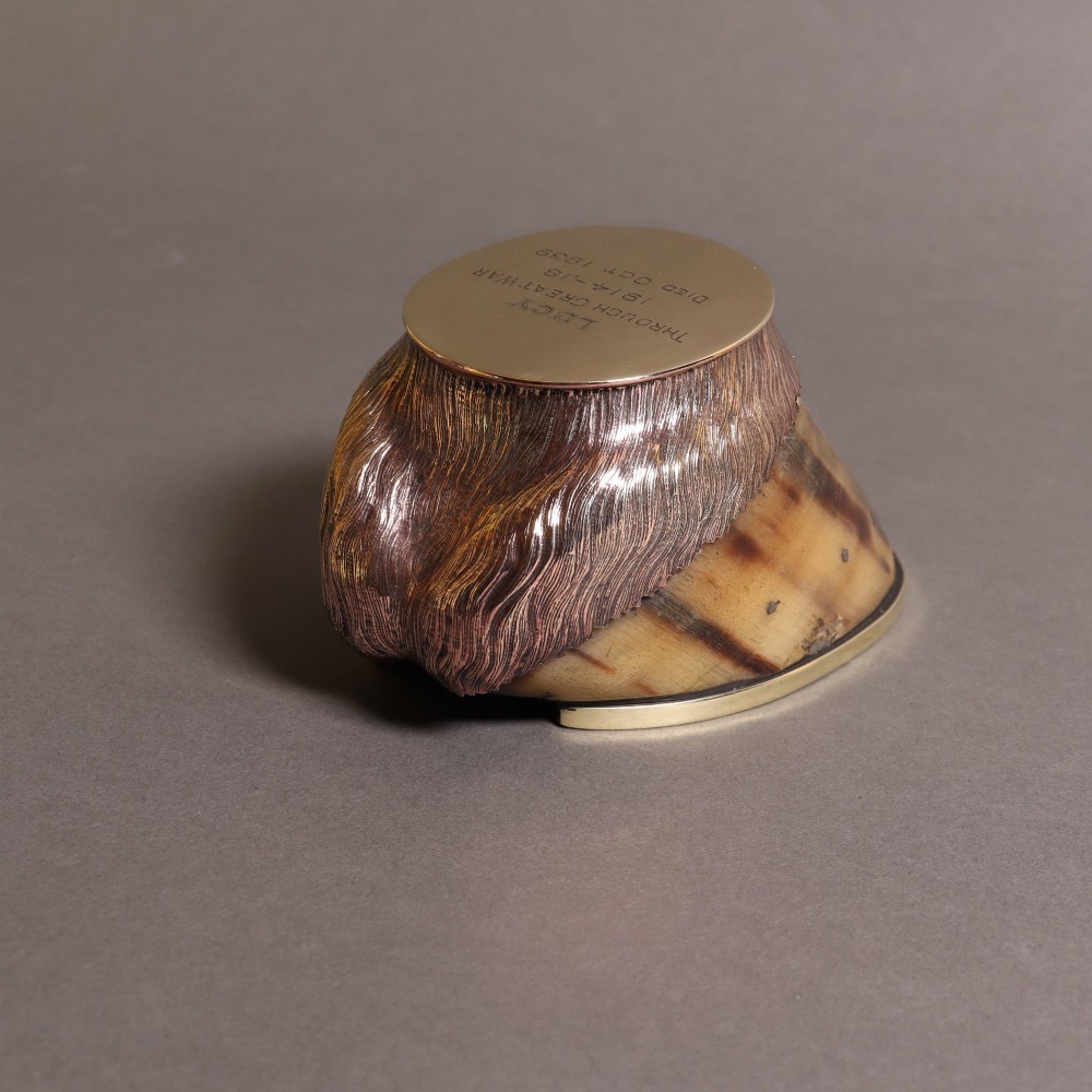 A preserved horse hoof mounted with an engraved brass top plate detailing military service dates and fitted with a polished brass rim around the base. View VIII