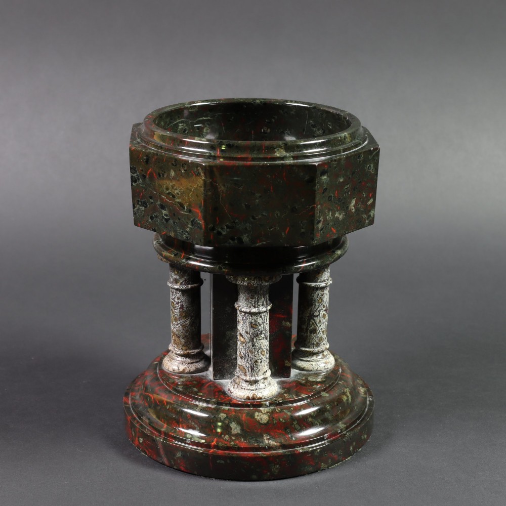 A late 19th-century carved Cornish serpentine stone model of an ecclesiastical font featuring an octagonal bowl supported by four turned columns on a circular base. View III