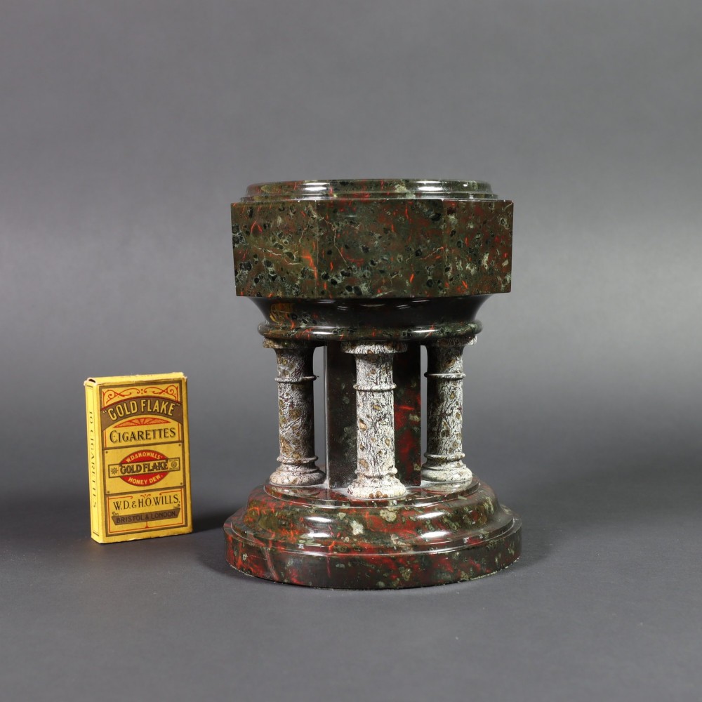 A late 19th-century carved Cornish serpentine stone model of an ecclesiastical font featuring an octagonal bowl supported by four turned columns on a circular base. View IV