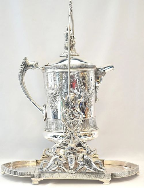 A HUGE ELABORATE ENGRAVED EMBOSSED WITH FIGURINES TILTING PITCHER WITH STAND - ADDITIONAL PHOTO 2