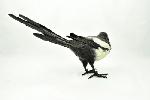fig 2. An antique cold-painted bronze figure depicting a magpie with detailed black and white polychrome finish.