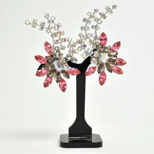 fig 7. A 1950s Christian Dior costume jewellery parure set featuring a necklace, brooch, and clip-on earrings with pink, green, and aurora borealis crystal floral clusters.