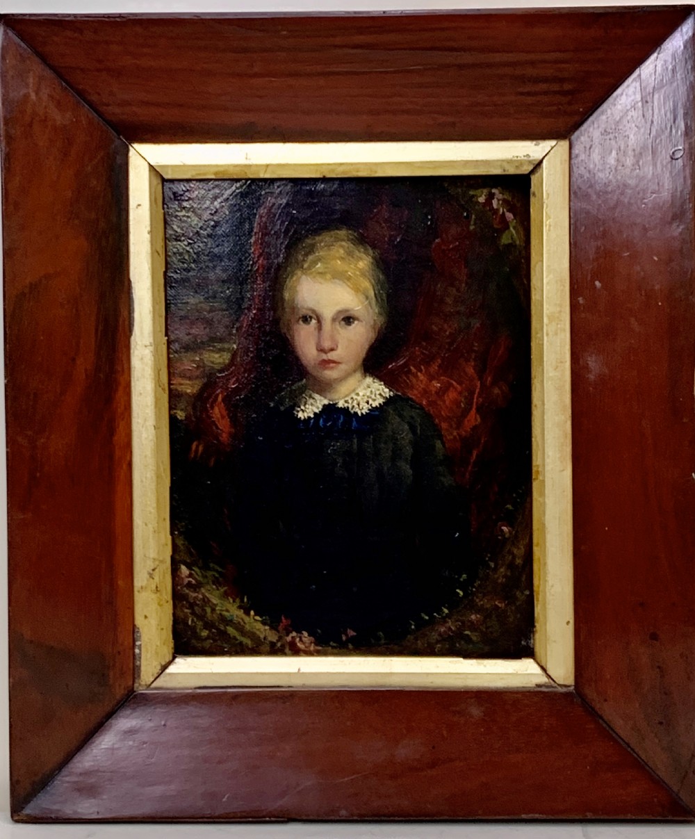 An early 19th-century oil painting depicting a child with light hair wearing a lace collar, set inside a broad wooden frame with a thin gilded inner slip.