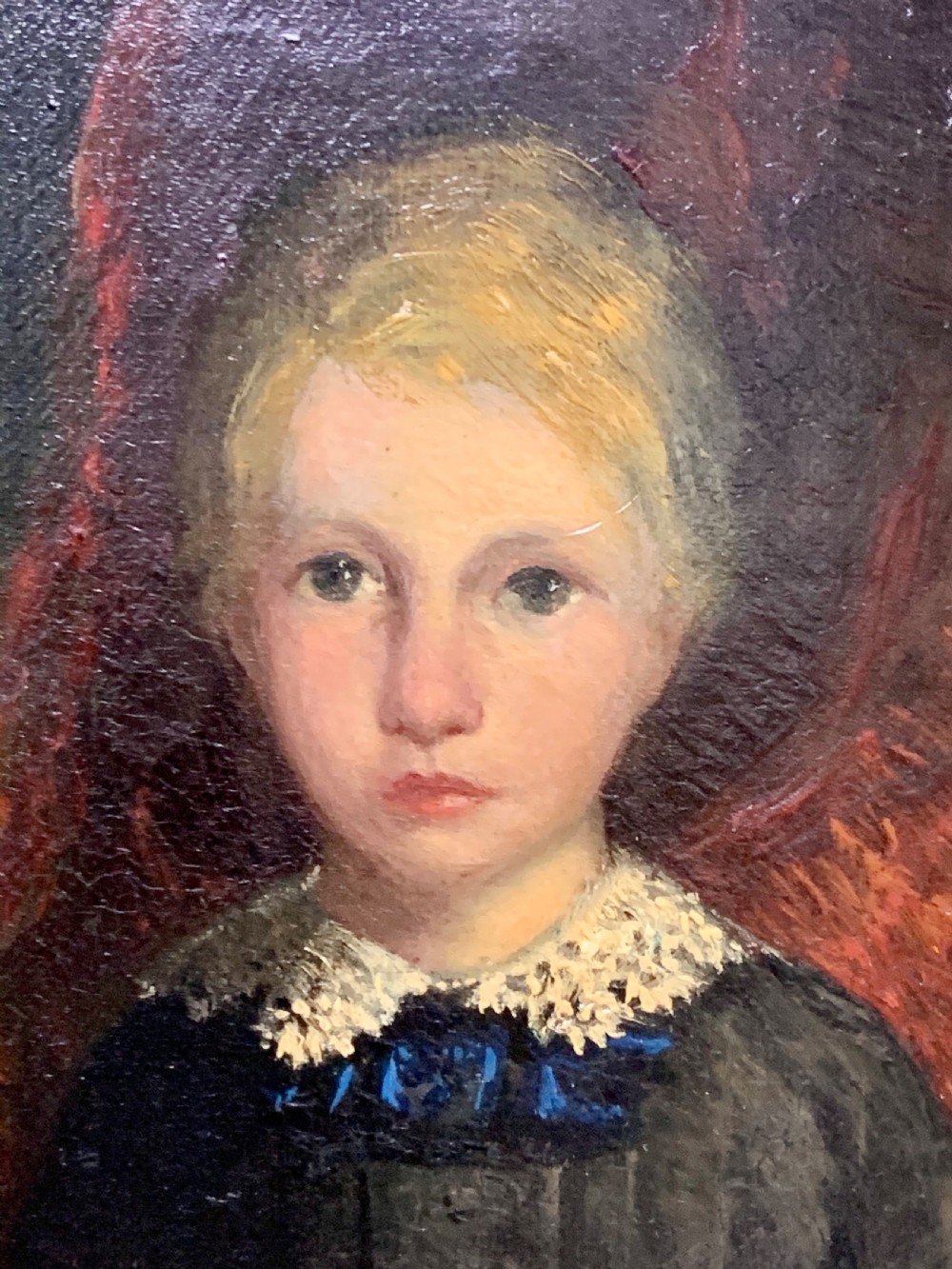 An early 19th-century oil painting depicting a child with light hair wearing a lace collar, set inside a broad wooden frame with a thin gilded inner slip. View III