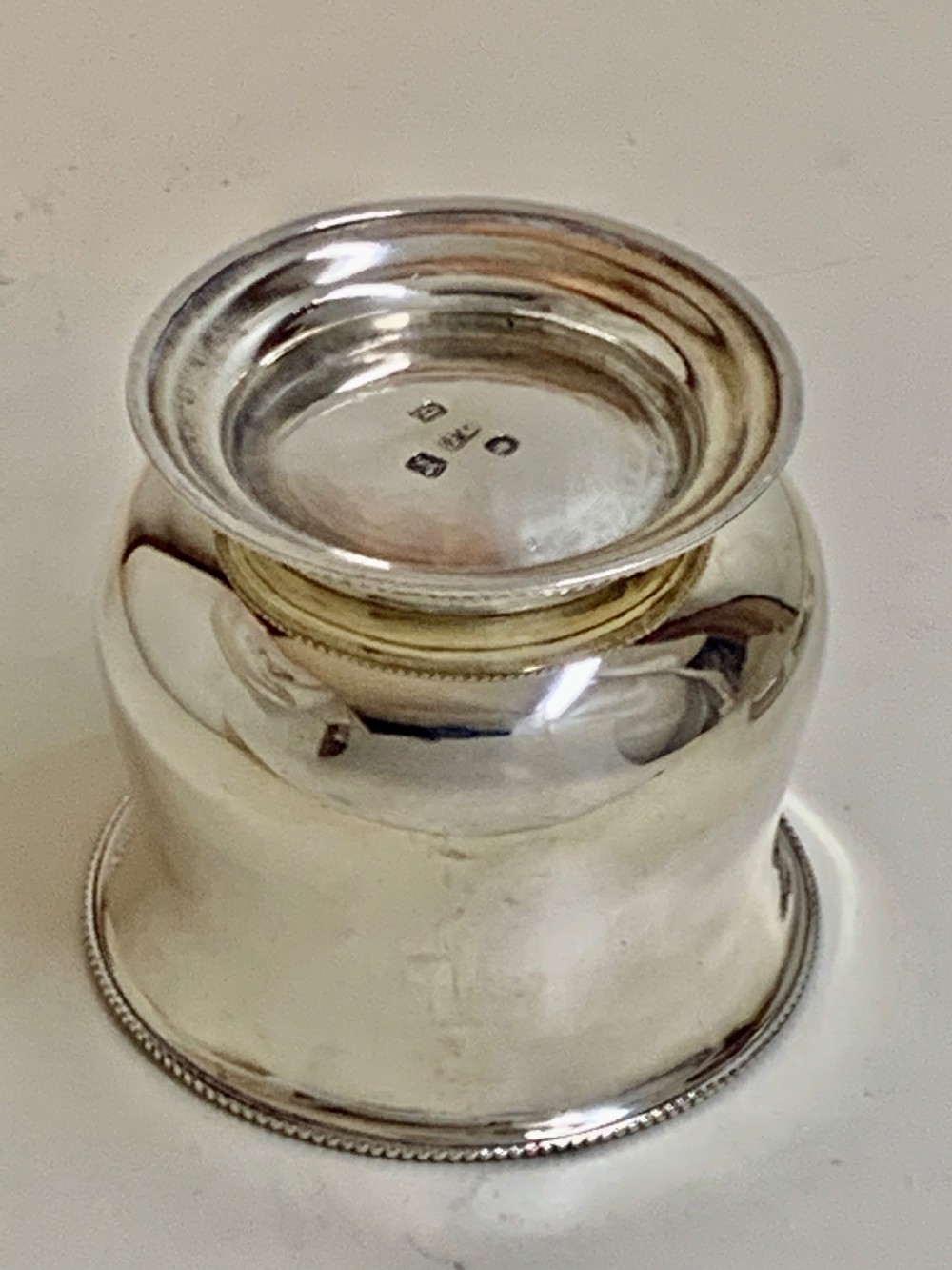 A sterling silver George III sugar bowl featuring a baluster form, beaded rim, and a circular pedestal foot. View V