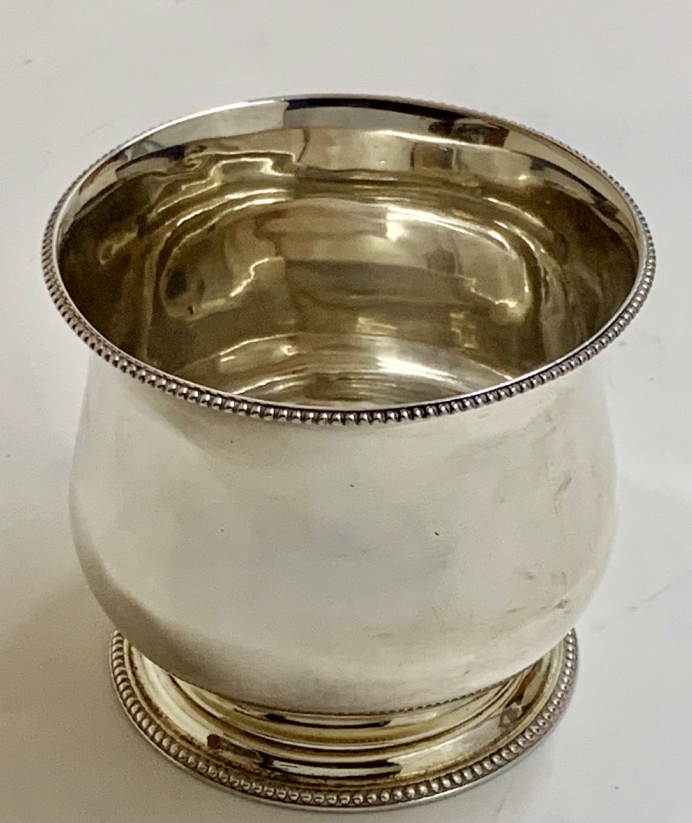 A sterling silver George III sugar bowl featuring a baluster form, beaded rim, and a circular pedestal foot. View IV