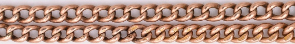An antique 9ct rose gold curb link Albert chain necklace featuring a swivel clasp attachment and a central T-bar drop. View V