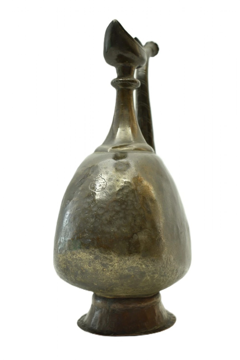 An antique dark bronze ewer featuring a bulbous body, a slender curved spout, a flared pedestal base, and a crescent moon finial. View V