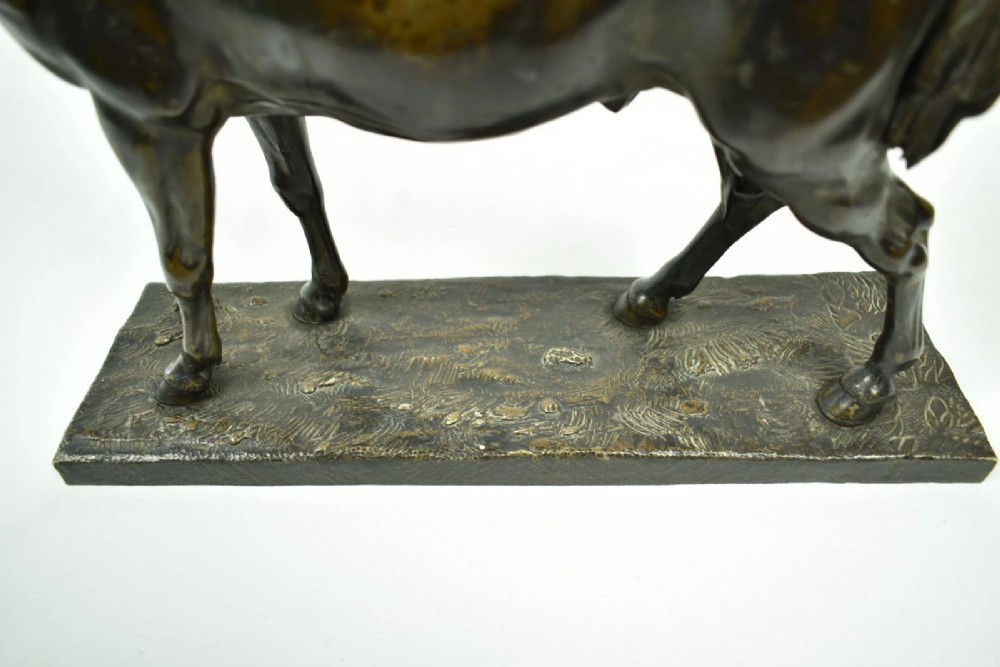 A dark brown patinated bronze sculpture of a standing horse positioned on an integral rectangular base. View VI