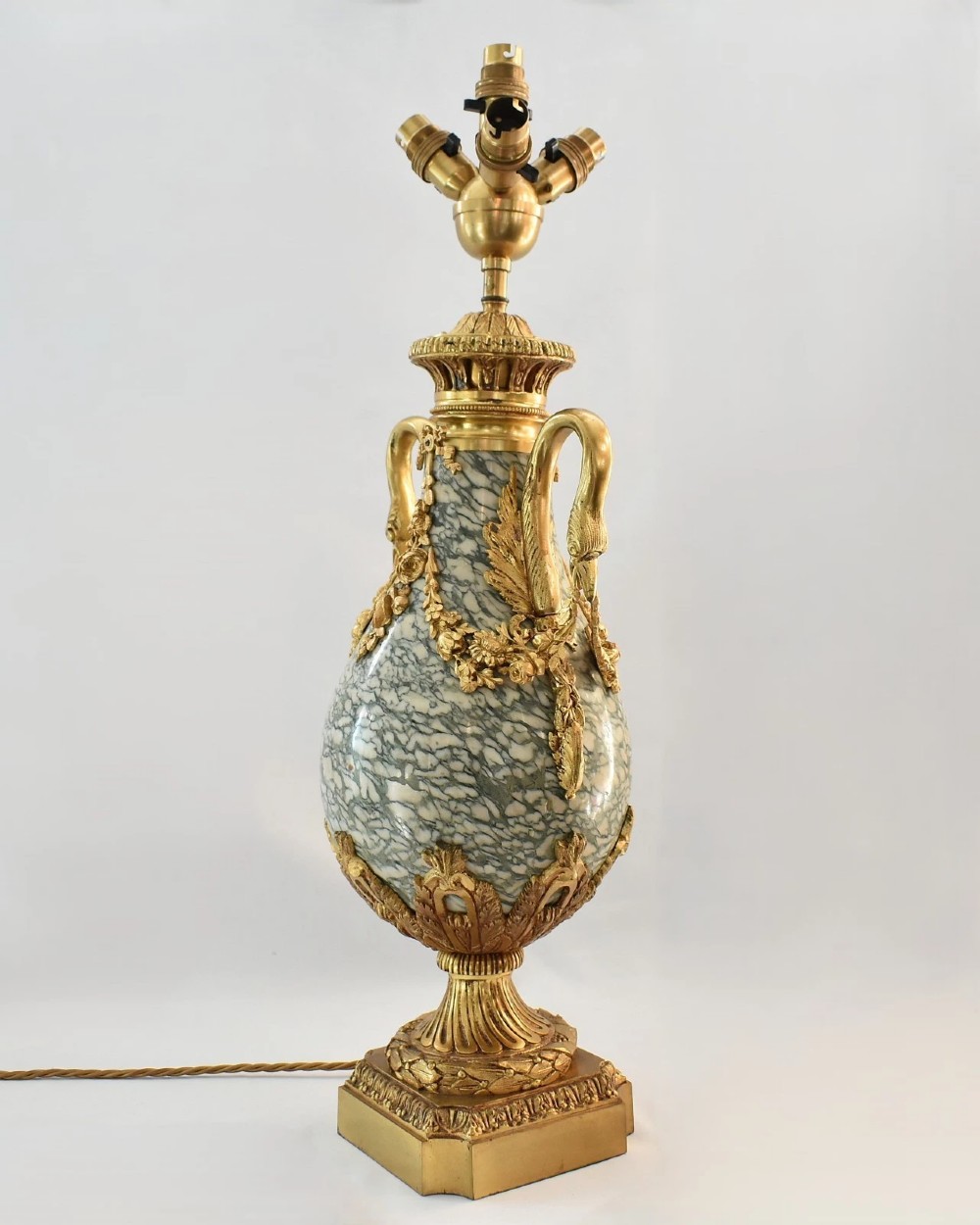 A pair of nineteenth-century French Louis XVI style cassolette table lamps crafted from green mottled marble with gilt bronze mounts and handles. View II