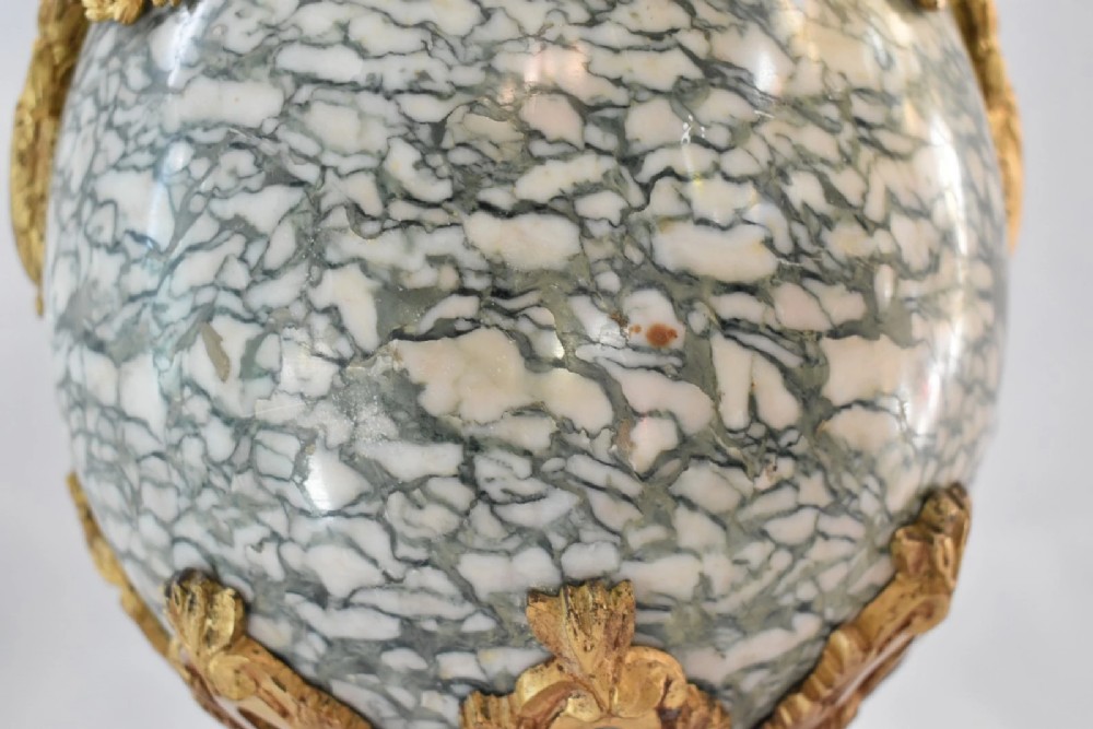 A pair of nineteenth-century French Louis XVI style cassolette table lamps crafted from green mottled marble with gilt bronze mounts and handles. View XI