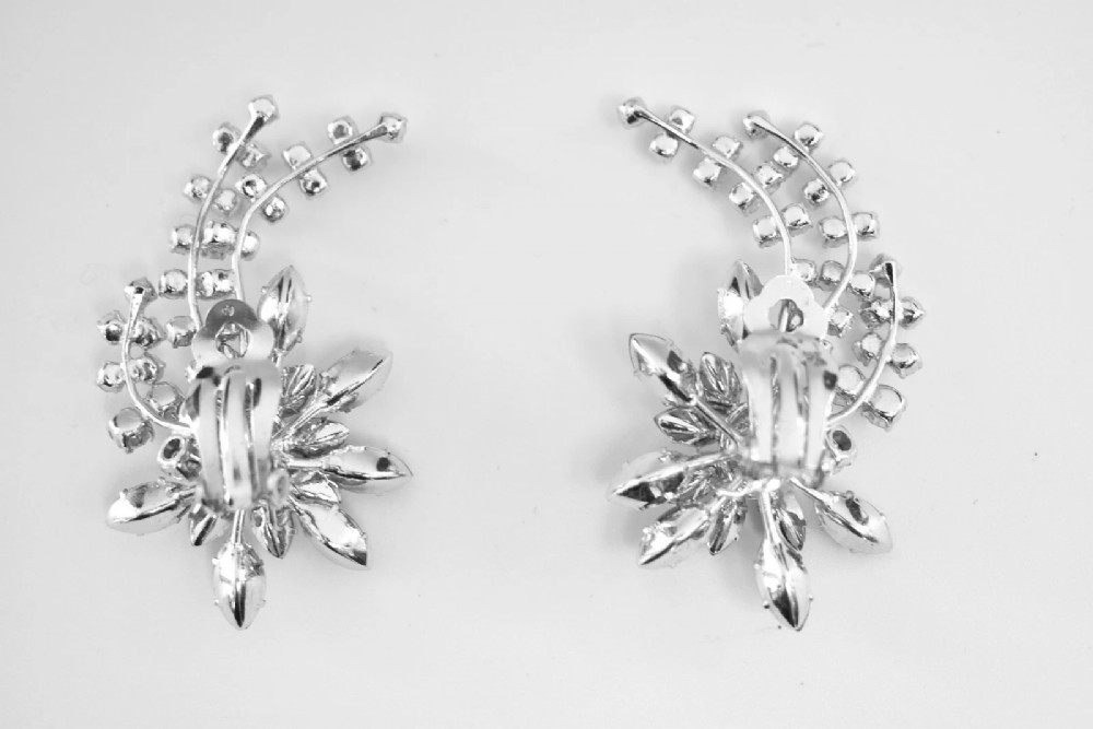 A 1950s Christian Dior costume jewellery parure set featuring a necklace, brooch, and clip-on earrings with pink, green, and aurora borealis crystal floral clusters. View IX